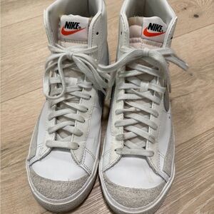 Nike White Sneakers with Orange Logo and Light Gray Accents